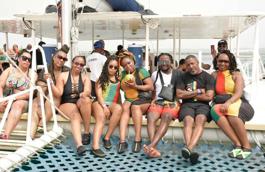 All Resorts: Ricks Cafe Sunset Catamaran Cruise - Boarding the catamaran in shallow water