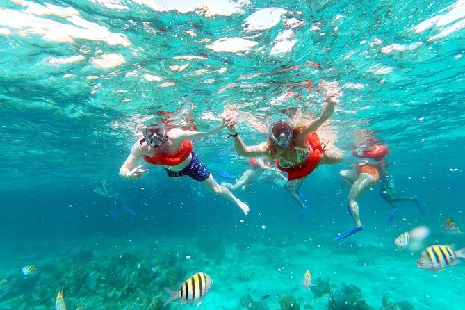 Catamaran Cruise Full Day Tour to Reef, Caves and Negril Beach - Life aboard the boat: music, drinks, and a party mood