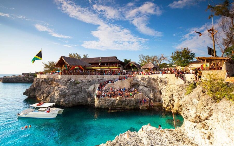 From Montego Bay: Negril Beach & Rick's Cafe Sunset Day Trip - Margaritaville and the optional shopping time