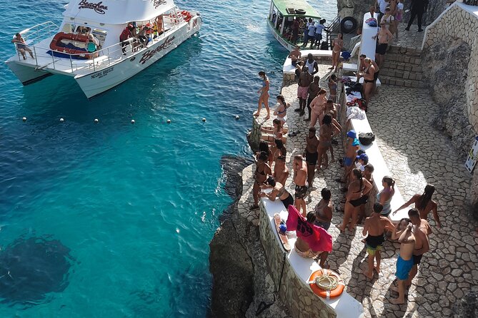 Full Day ATV, Ricks Café, Beach and Shopping Tour from Montego Bay - Rick’s Café: Cliff Jumps and a Lively Finish