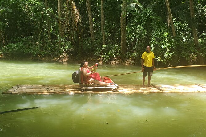 Martha Brae Bamboo River Rafting With Transportation - A private raft, with a larger operation behind it