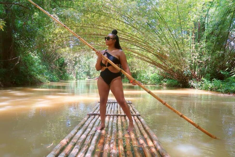Martha Brae River Rafting Private Tour with Transportation - Settling onto the bamboo raft