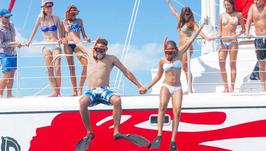 Montego Bay: Reggae Family Catamaran Cruise with Snorkeling - Sailing the coastline with snacks and reggae