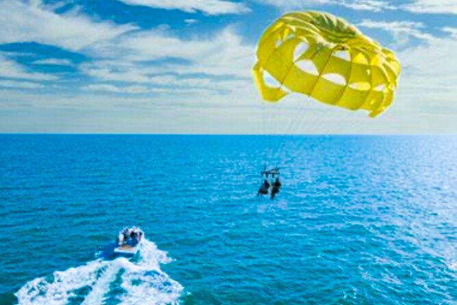 Parasailing above Turquoise Ocean Waters in Montego Bay - Coming Back Down for Beach and Swim Time