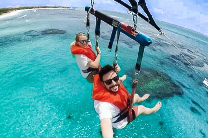 Parasailing above Turquoise Ocean Waters in Montego Bay - Arriving, Changing, and Getting Ready