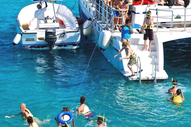 Party Catamaran and Snorkeling Tour in Montego Bay - Boarding the catamaran and settling into the party