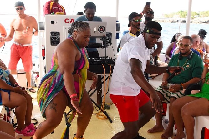Party Catamaran: OpenBar, Music, Negril Beach, Caves, Snorkeling - Rick’s Cafe, cliff jumping, and the sunset