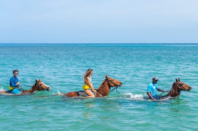 Private ATV Ride and Bamboo Rafting Adventure In Jamaica - ATV riding on muddy trails and rolling hills